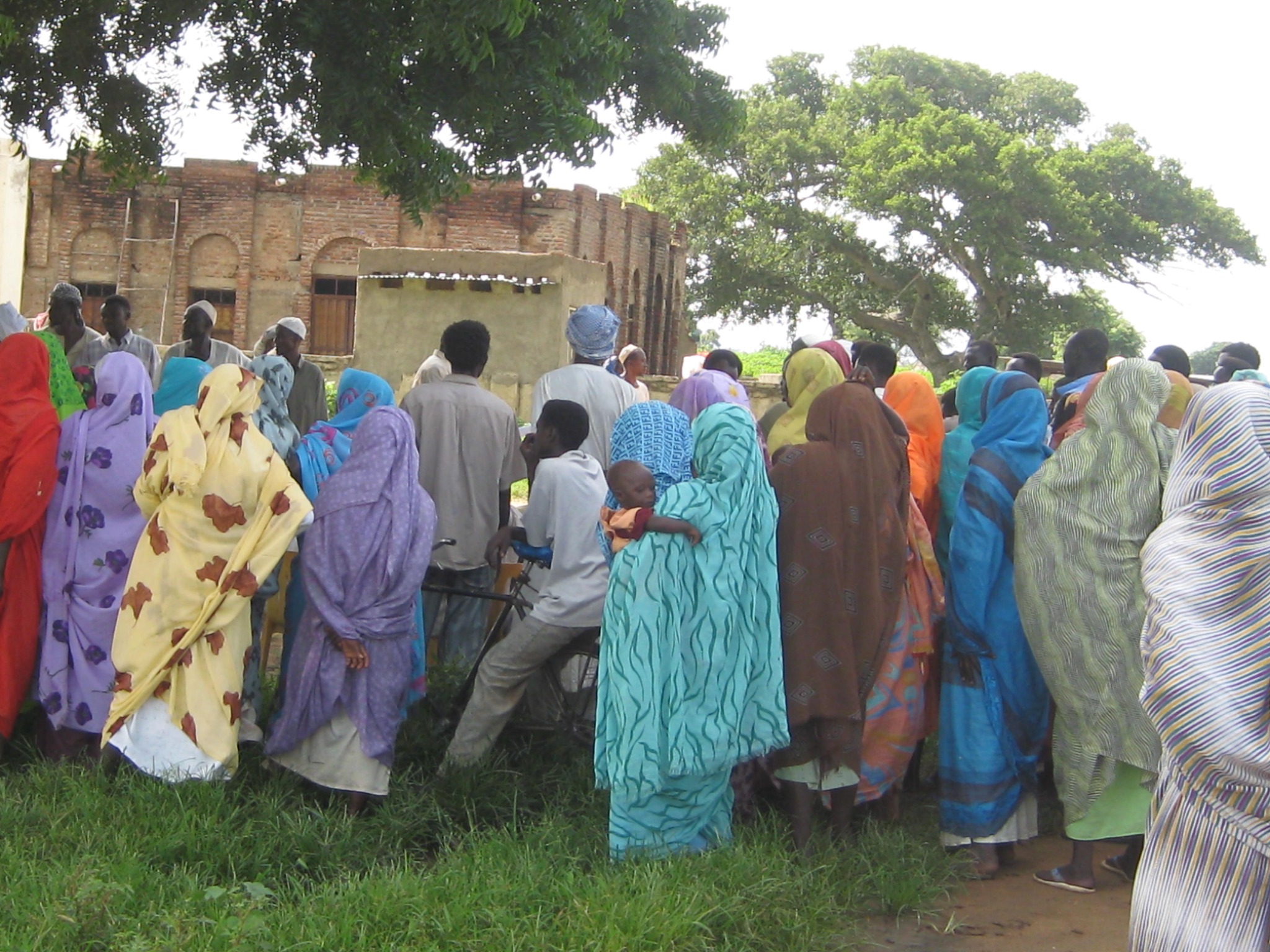 Community gathering outdoors near a building